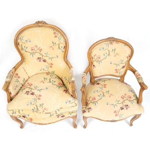 1014 - A 20th century French fauteuil armchair upholstered in floral fabric together with a similar salon a... 