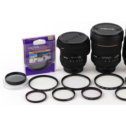 518 - A collection of Sigma lenses and filters including 12-24mm, 10-20mm, 70-300mm and 105mm macro.