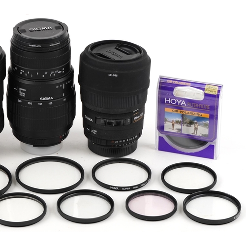 518 - A collection of Sigma lenses and filters including 12-24mm, 10-20mm, 70-300mm and 105mm macro.