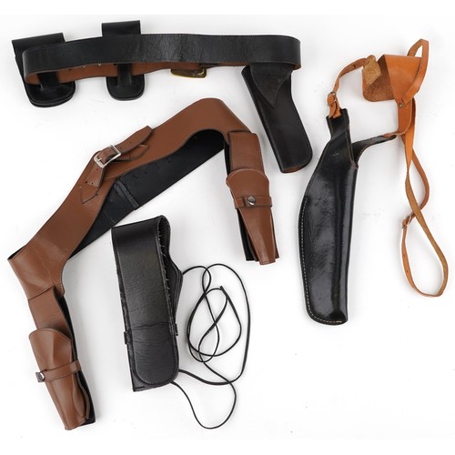 2524 - Four vintage and later leather gun holsters with belts.