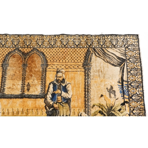 1112 - An early to mid 20th century Middle Eastern tapestry wall hanging depicting a lady being fanned and ... 