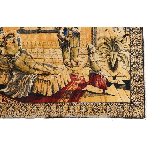 1112 - An early to mid 20th century Middle Eastern tapestry wall hanging depicting a lady being fanned and ... 