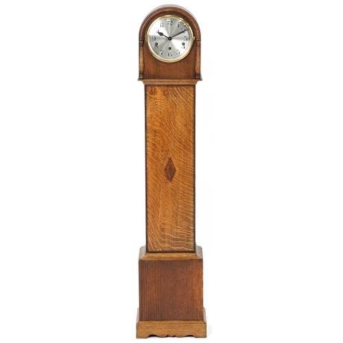 1037 - A George V oak longcase clock with silvered dial, 131cm H x 25cm W x 18cm D.