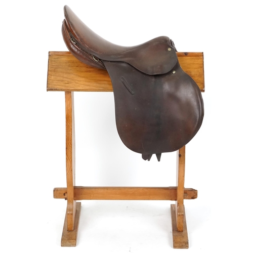 1163 - A 16 inch brown leather saddle.