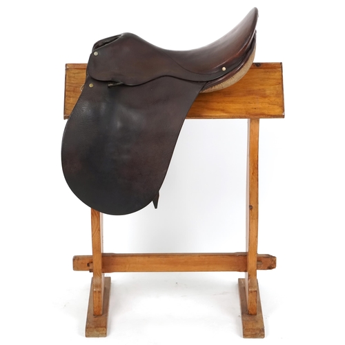 1159 - A George Parker 16 inch brown leather saddle.