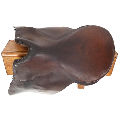 1159 - A George Parker 16 inch brown leather saddle.