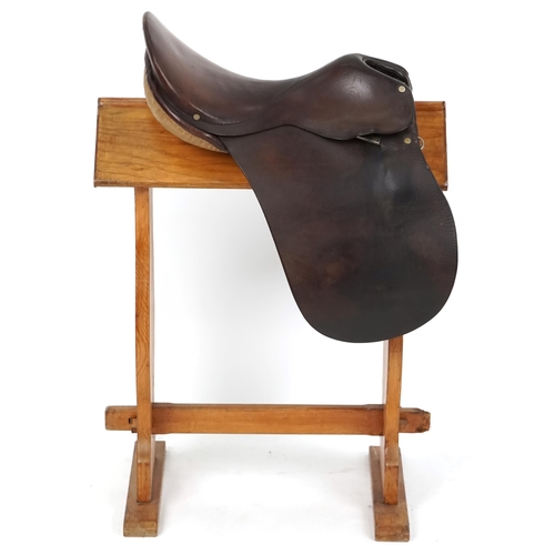 1159 - A George Parker 16 inch brown leather saddle.