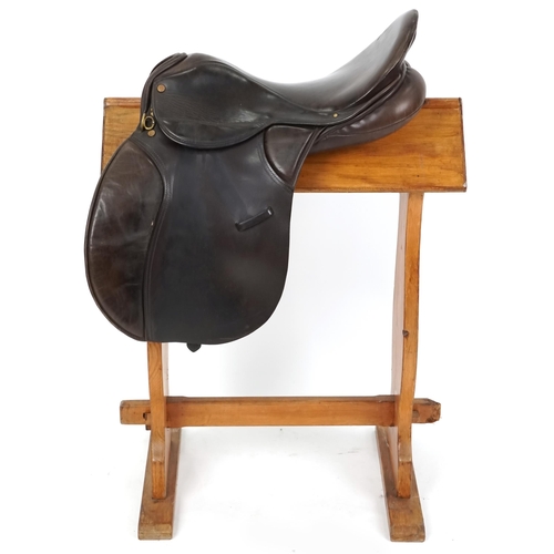 1156 - A Minister Saddlery 16.5 inch brown leather saddle.