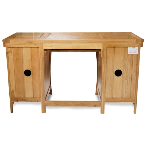 1068 - A modern solid oak twin pedestal desk fitted with three drawers above cupboards, 80cm H x 140cm W x ... 