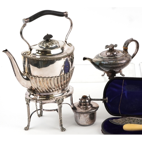 1431 - A group of Victorian and later plated items including a teapot on stand with burner and fish servers... 