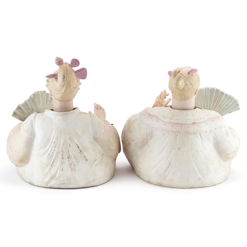 29 - A pair of late 19th century German bisque nodding Chinese figures, each holding a fan and in a kneel... 