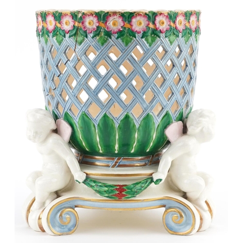 1367 - A late 19th/early 20th century continental Majolica jardinière with hand painted and pierced decorat... 