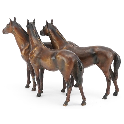 1500 - A German bronzed spelter study of three horses, 26cm in length.