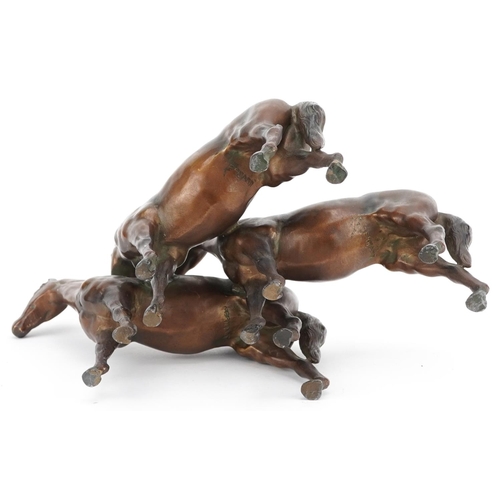 1500 - A German bronzed spelter study of three horses, 26cm in length.