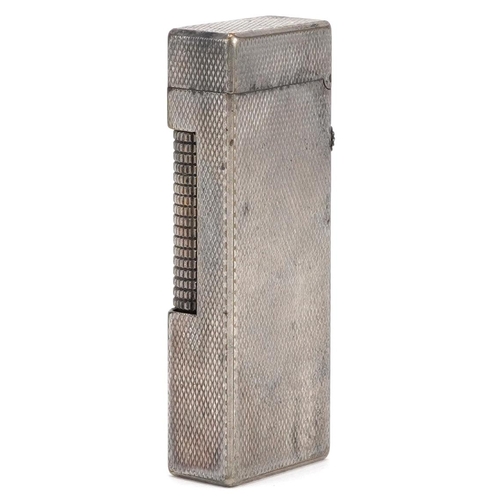 75 - A silver plated Dunhill engine turned pocket lighter numbered RE24163, 6.5cm high.