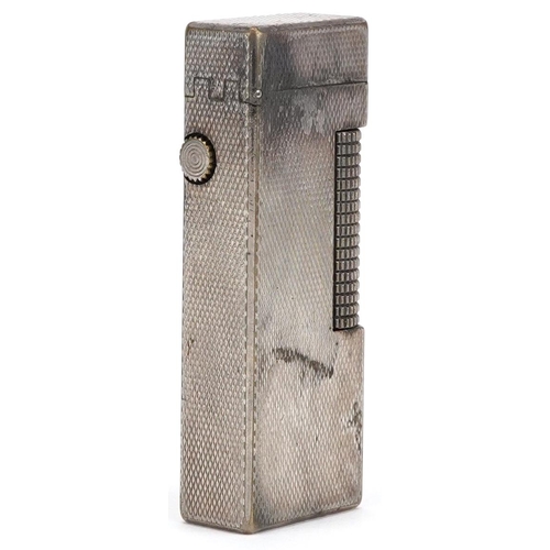 75 - A silver plated Dunhill engine turned pocket lighter numbered RE24163, 6.5cm high.