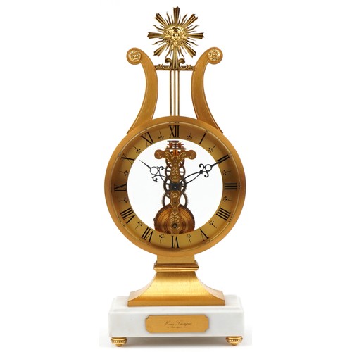 163 - A 20th century gilt bronze and white marble mantle clock with Roman numerals, the base mounted with ... 