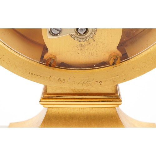 163 - A 20th century gilt bronze and white marble mantle clock with Roman numerals, the base mounted with ... 