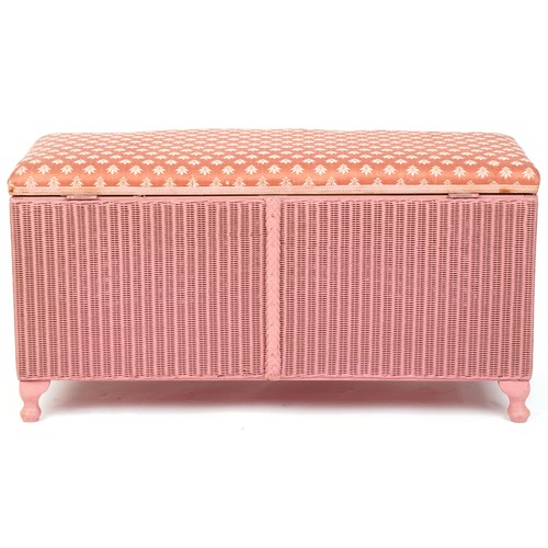 1004 - A pink Lloyd Loom box seat stool raised on cabriole legs, 47cm H x 93cm W x 43cm D.