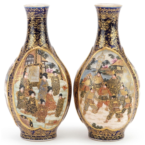  A pair of Japanese Satsuma earthenware vases, late 19th century, each decorated with three tradition... 