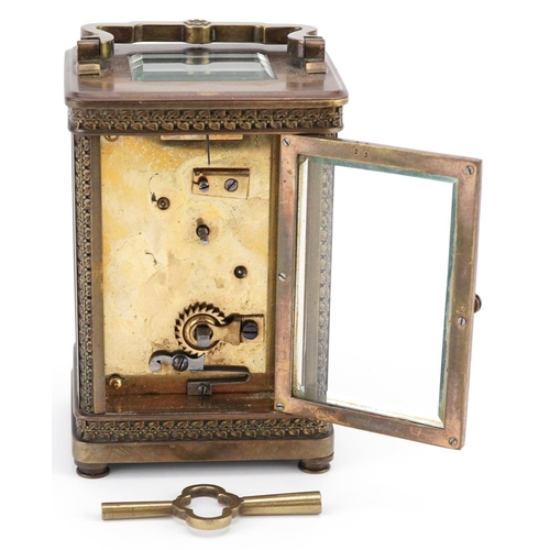 66 - An Edwardian gilt brass carriage clock with white enamelled dial, detailed A.W. Fraser, Grantown-on-... 