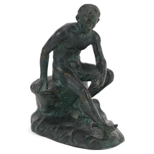 72 - A 20th century green patinated bronze figure of Apollo seated on a rock, 10cm high.