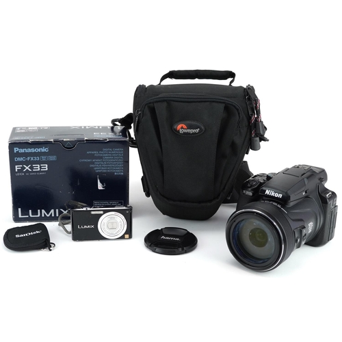  A Nikon Coolpix P1000 camera and a Panasonic Lumix FX33 digital camera.