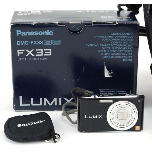  A Nikon Coolpix P1000 camera and a Panasonic Lumix FX33 digital camera.