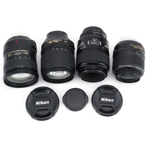 505 - Four Nikon cameral lenses comprising 18-55mm VR, 18-200mm VR, 18-105mm and 105mm F/2.8 macro.