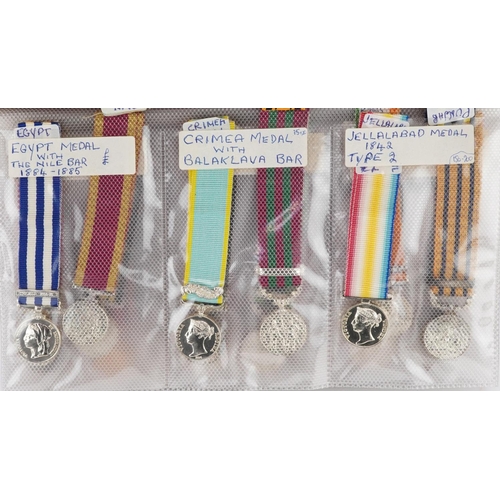 2418 - A collection of military interest miniature dress medals including Canadian Ghuzee Cabul medal, Chin... 