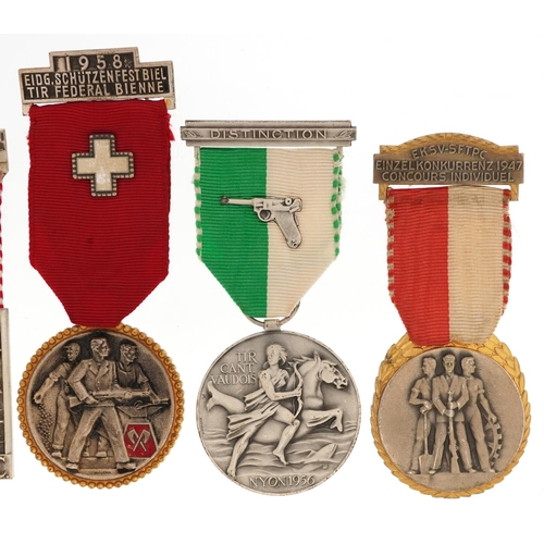 2487 - Six military interest medals with ribbons including Swiss Rifle trophy badge and New Zealand