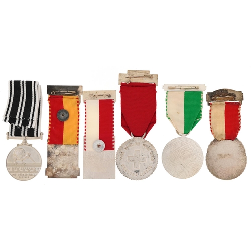 2487 - Six military interest medals with ribbons including Swiss Rifle trophy badge and New Zealand