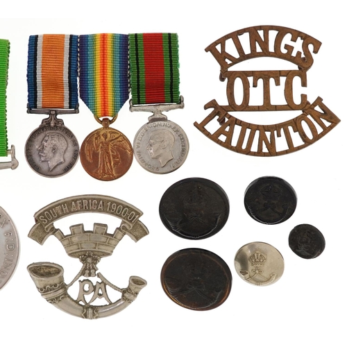 2401 - British military World War I medal pair and World War II Defence medal with dress medals, cap badges... 