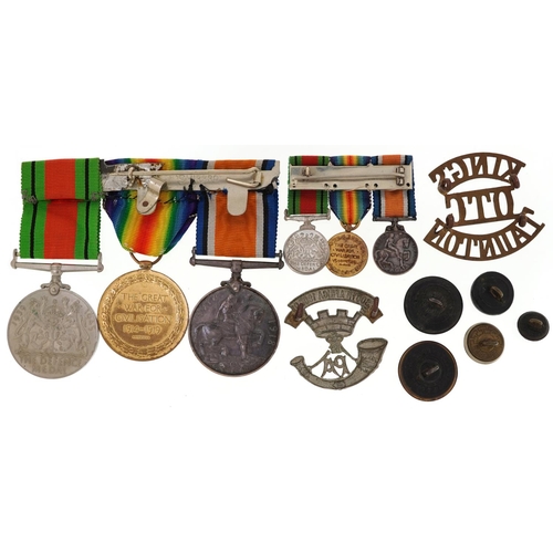 2401 - British military World War I medal pair and World War II Defence medal with dress medals, cap badges... 