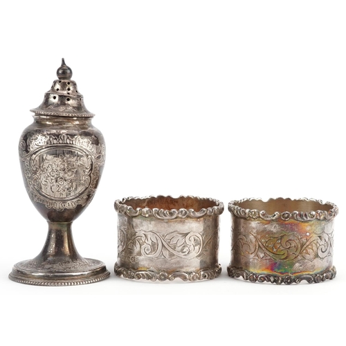 450 - A Victorian silver baluster shaped caster and a pair of silver plated napkin rings, the caster 9.5cm... 