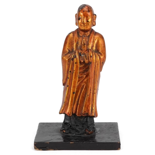 154 - A Japanese carved softwood and gilded figure of a sage, 20th century, mounted on a later wooden base... 