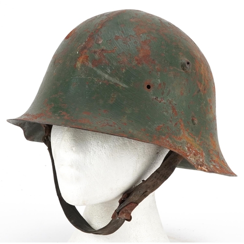 2600 - A Romanian military interest tin helmet with liner.