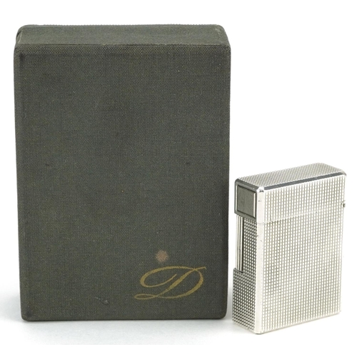 76 - S T Dupont silver plated engine turned pocket lighter with box and paperwork, 5cm high.