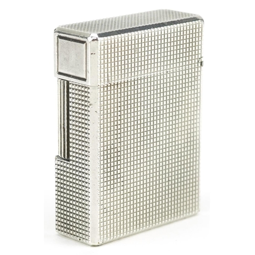 76 - S T Dupont silver plated engine turned pocket lighter with box and paperwork, 5cm high.