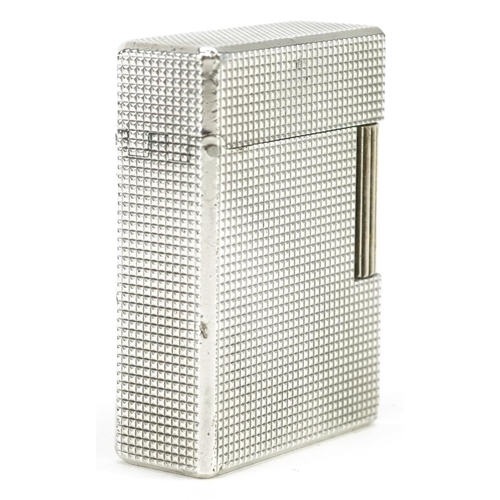 76 - S T Dupont silver plated engine turned pocket lighter with box and paperwork, 5cm high.