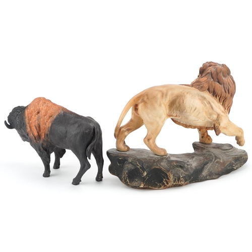 1215 - A large Beswick matt glaze lion on a rock and a Coalport matt glaze bison, the largest 31cm in lengt... 