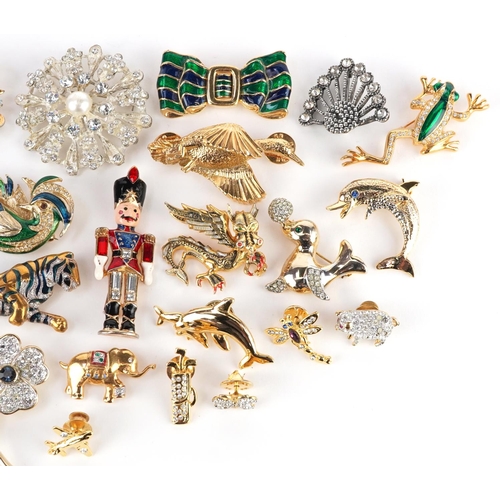 3327 - A collection of vintage and later brooches including a Christopher Radko enamelled soldier, jewelled... 