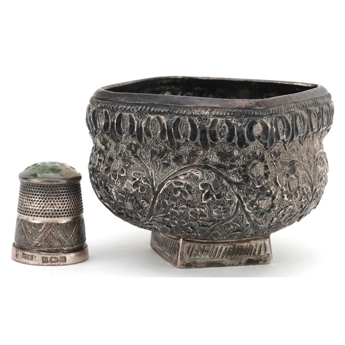 489 - A Middle Eastern silver coloured metal open salt and a miniature silver thimble with hardstone top, ... 