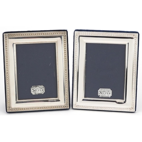 602 - Carrs, pair of rectangular silver easel photo frames with boxes, Sheffield 1996, 12.5cm x 10.5cm.