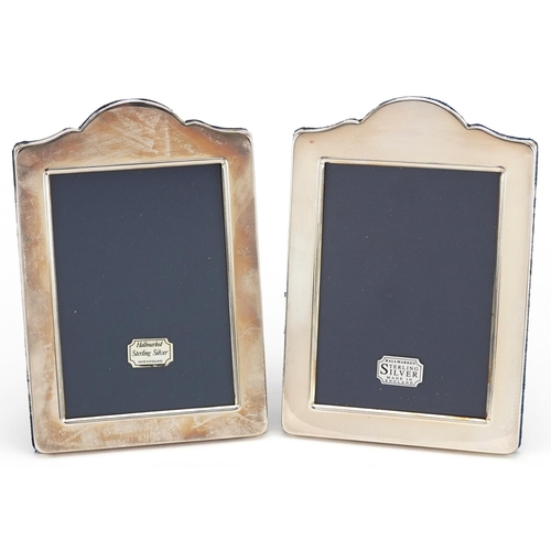 595 - Carrs, pair of rectangular silver easel photo frames with boxes, Sheffield 1994 and 1997, 17cm x 11.... 