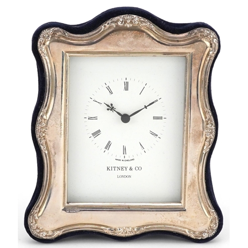 572 - Kitney & Co, embossed silver easel clock with box, London 1994, 15.5cm x 13cm.