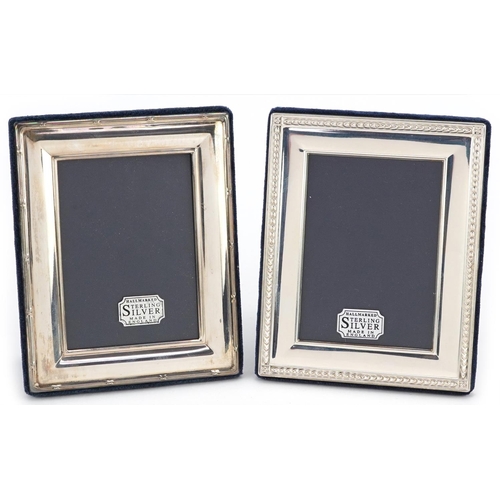 603 - Two rectangular embossed silver easel photo frames, Sheffield 1994 and 1997, 13cm x 10cm.