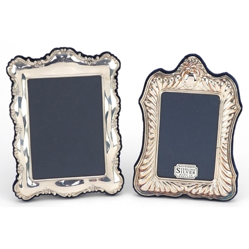 599 - Carrs, two rectangular embossed silver easel photo frames with boxes, Sheffield 1990 and 1991, the l... 