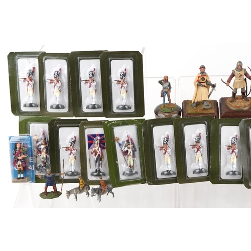 2527 - A large collection of hand painted lead military figures, many in sealed blister packs.