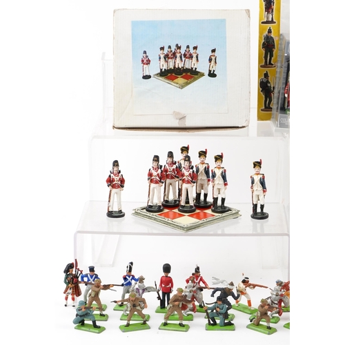 2522 - A collection of vintage and later hand painted lead and plastic military figures including W Britain... 